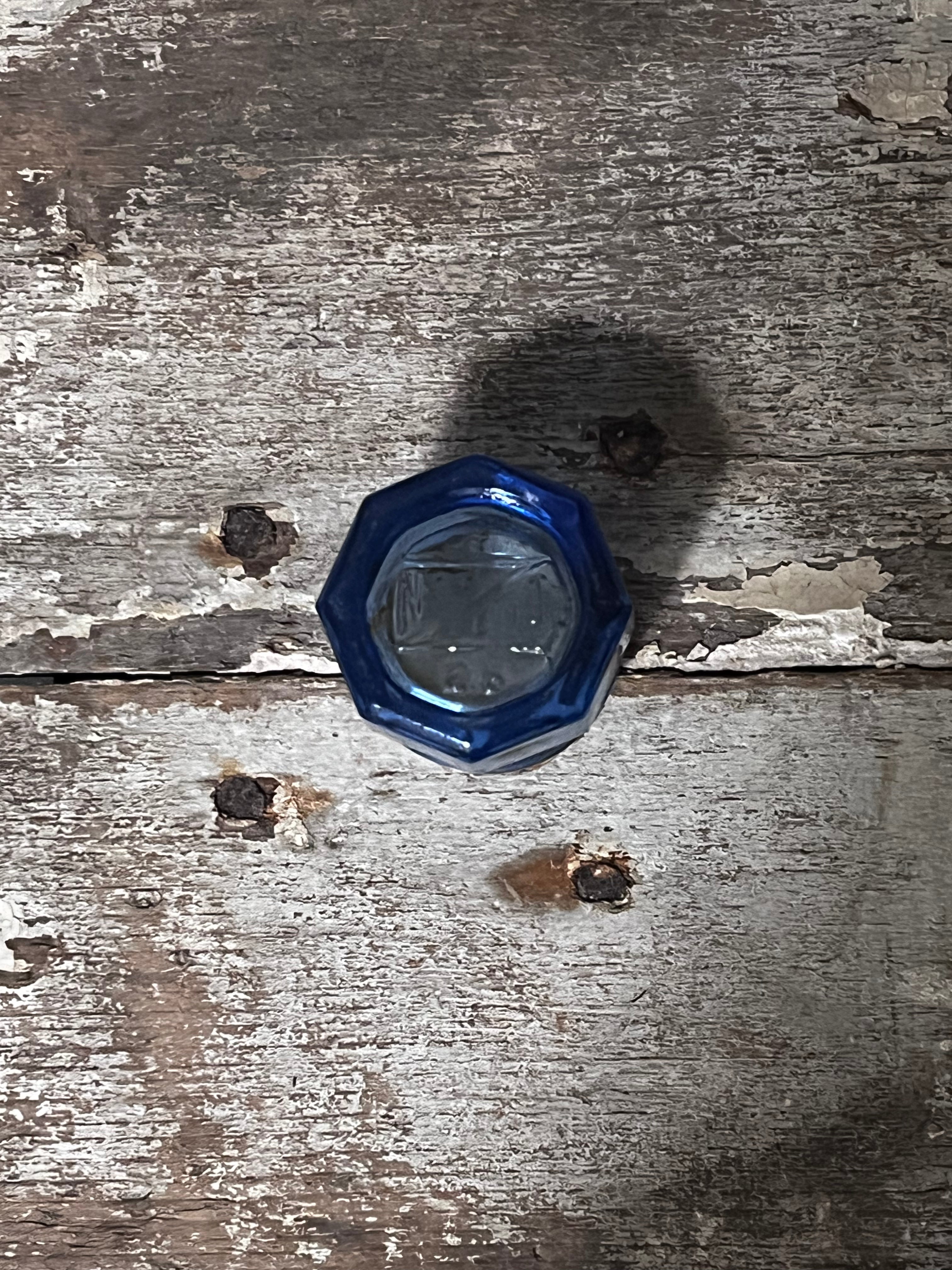 Miniature blue glass jar with cork lid