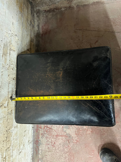 Vintage leather ottoman on wheels.