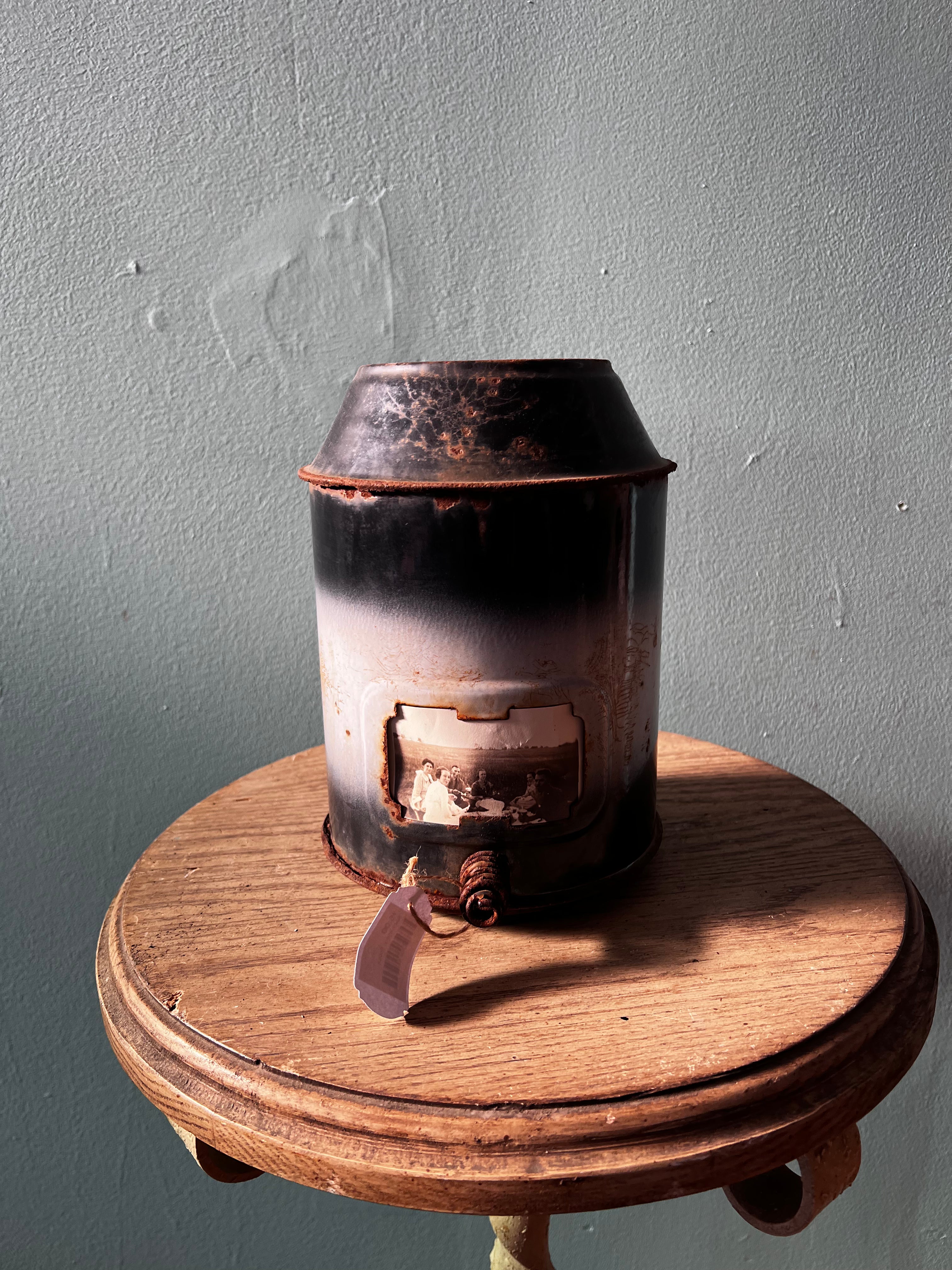 Metal canister with antique picture