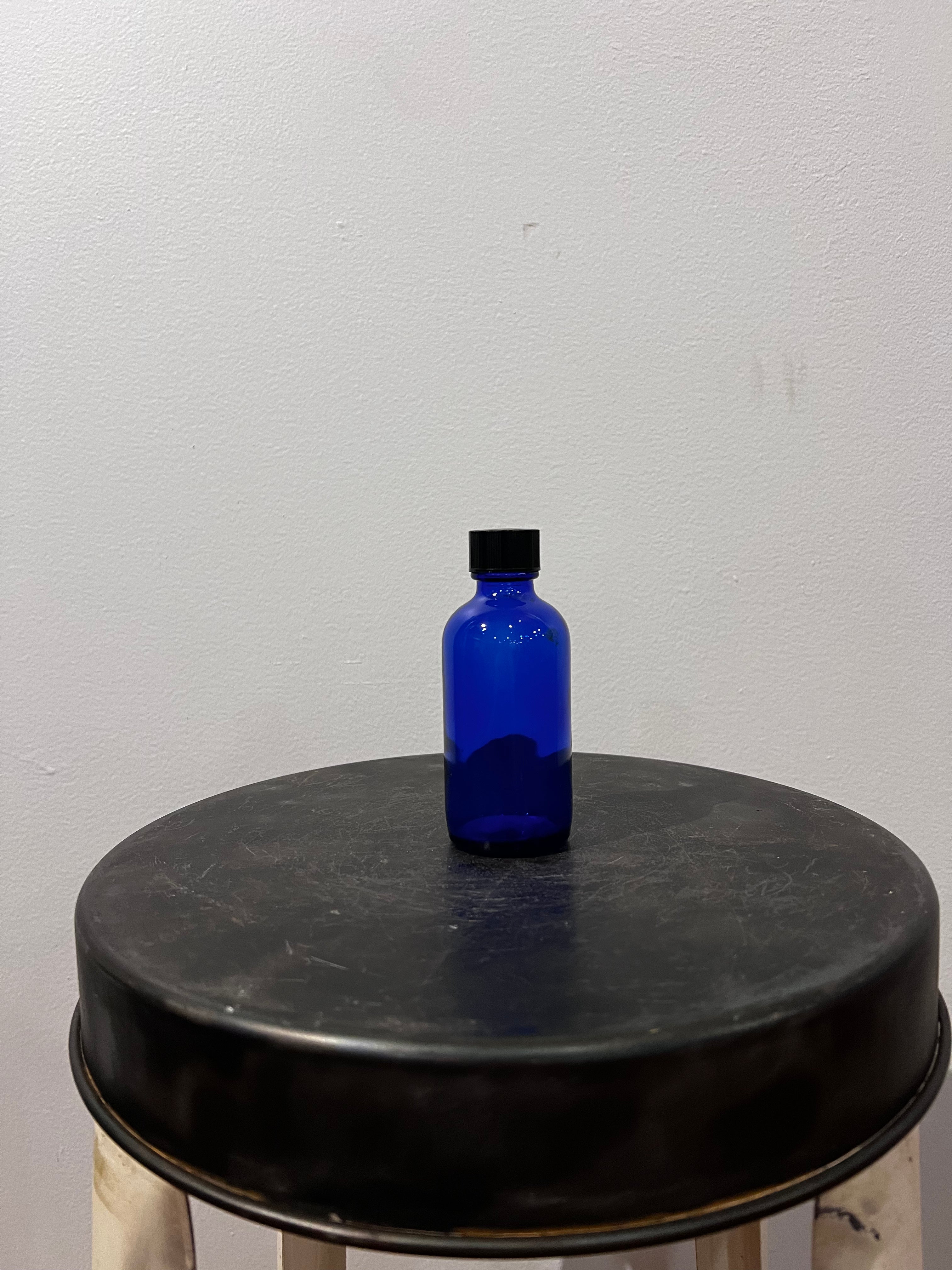 Small blue glass bottle